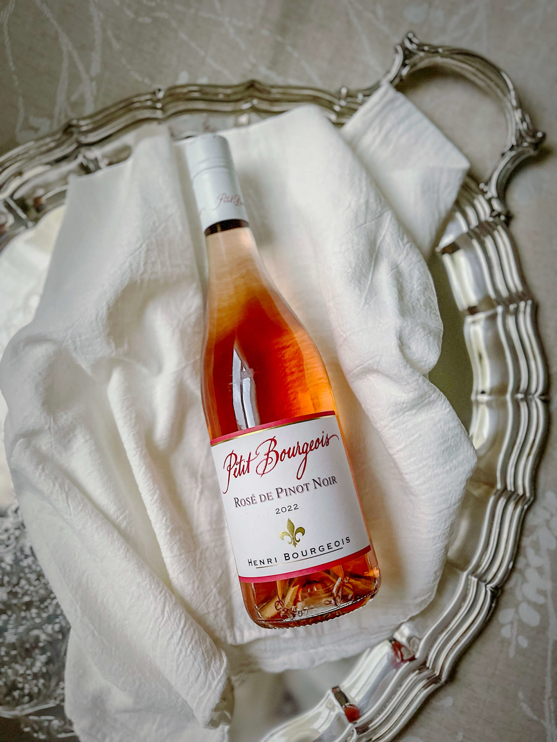 Petit Bourgeois Rosé de Pinot noir on a silver tray.